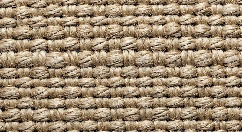 Nærbilde av grovt, beige sisal- eller jutestoff i vevd struktur